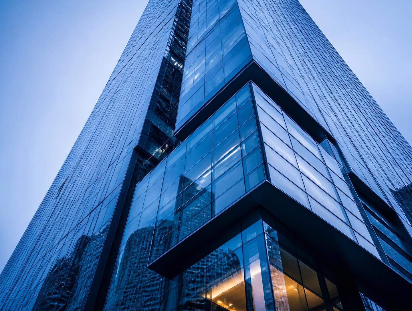 Modern glass commercial tower photographed from below
